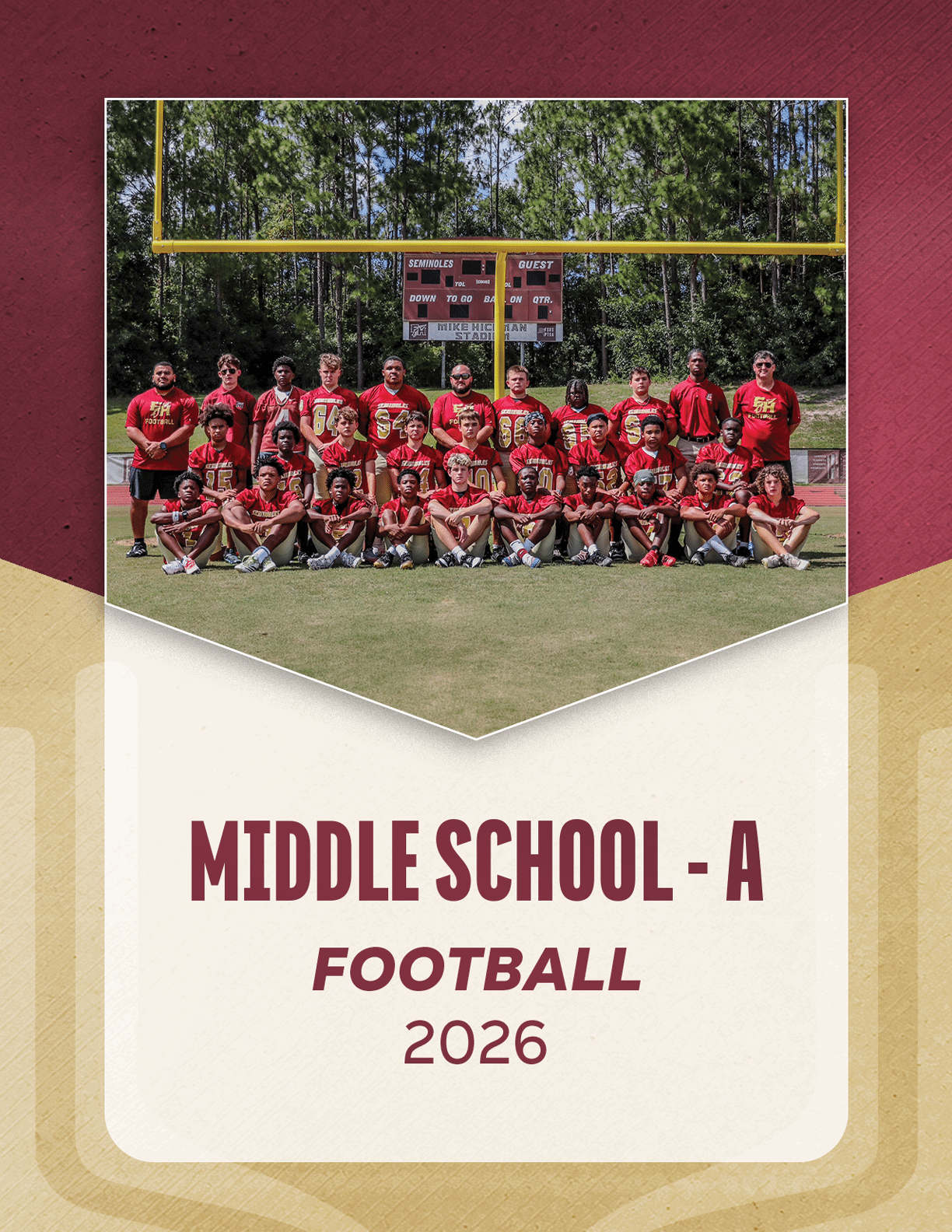 A group of people in football uniforms and coaches standing and kneeling on a grassy field with trees and a scoreboard in the background, labeled JV Football 2026. Description generated by AI