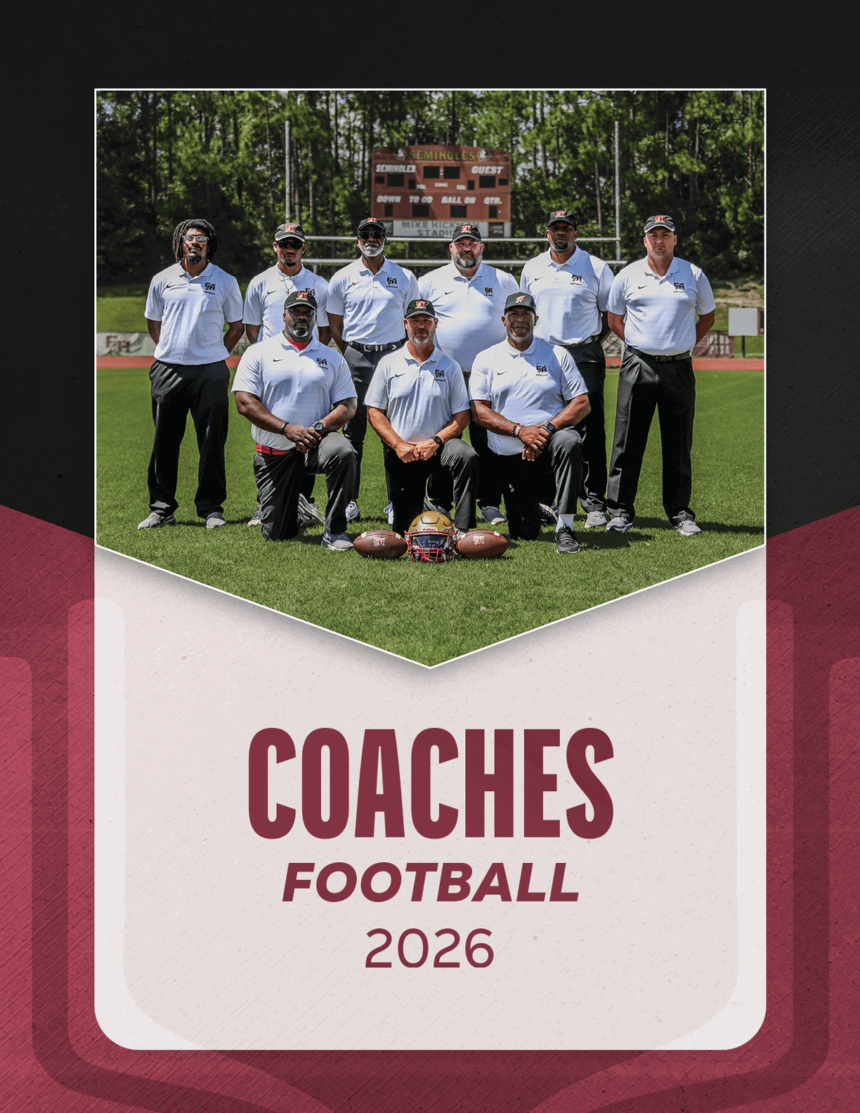 A group of eight adults wearing white polo shirts and dark pants pose on a football field with helmets and footballs in front of them under a scoreboard, with the text “Coaches Football 2026" below. Description generated by AI