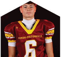 A young man wearing a white jersey with the number 10 on it. Description generated by AI