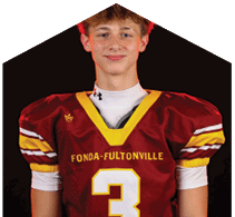 A young man wearing a white jersey with the number 10 on it. Description generated by AI