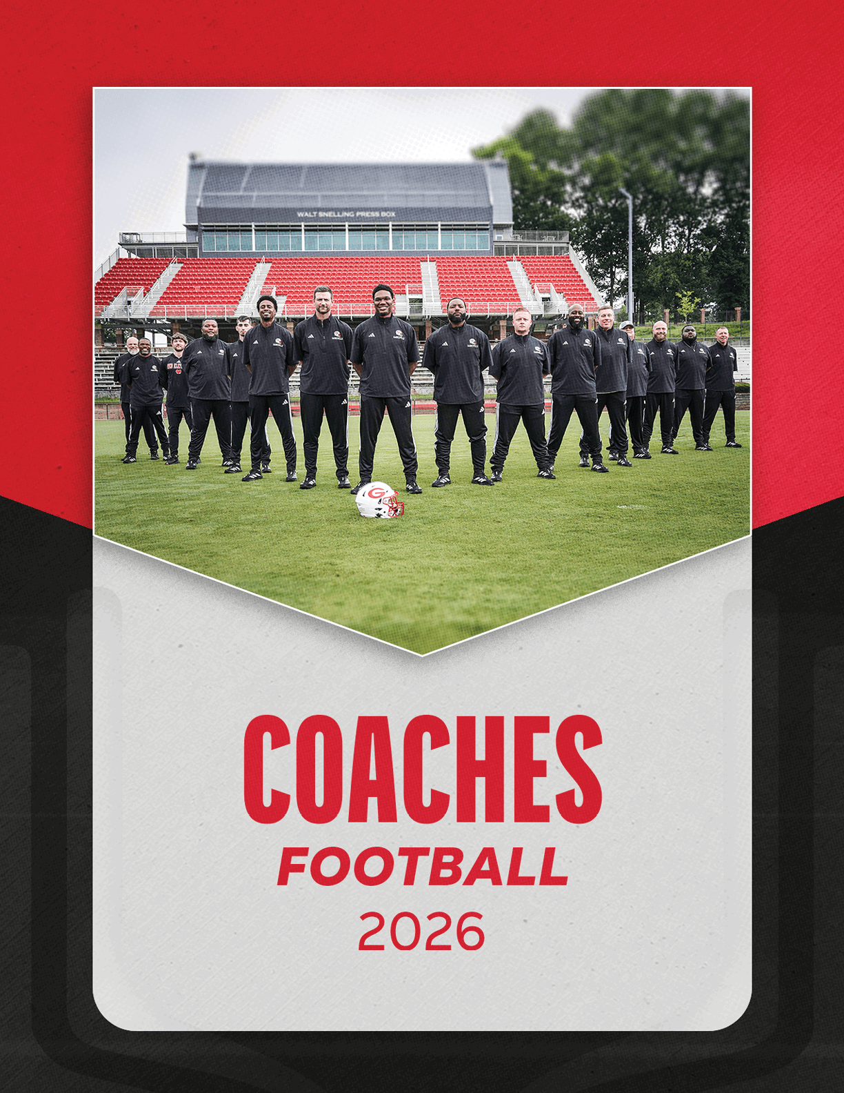 A group of people dressed in black sportswear stands on a soccer field in front of red and white stadium seats with a soccer ball placed on the grass in front of them and the text “COACHES FOOTBALL 2026" below. Description generated by AI