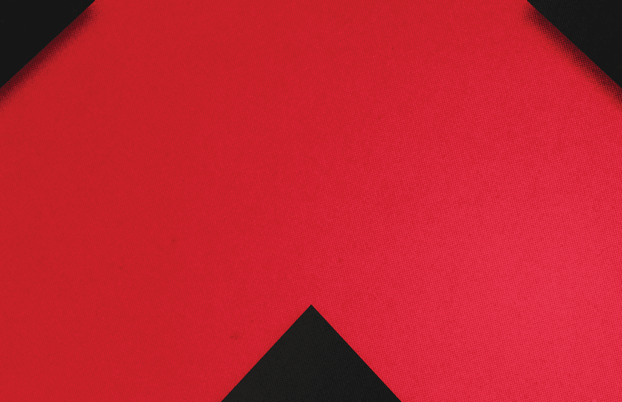 A red and black triangle. Description generated by AI