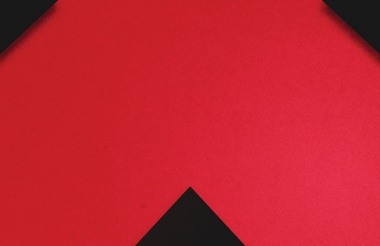 A red and black triangle. Description generated by AI