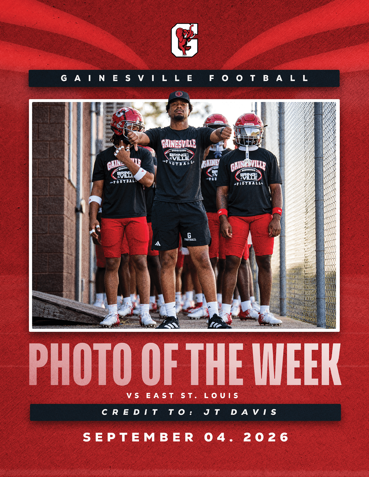 A group of people wearing Gainesville Football shirts and athletic shorts stand together on a sports field with one person pointing forward, framed by text announcing a football game against East St. Louis on September 4, 2026. Description generated by AI