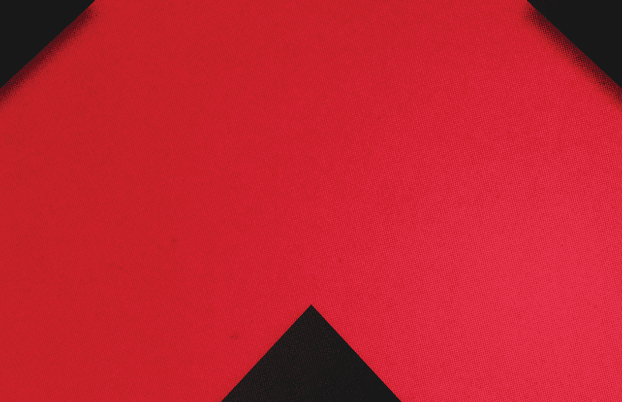 A red and black triangle. Description generated by AI