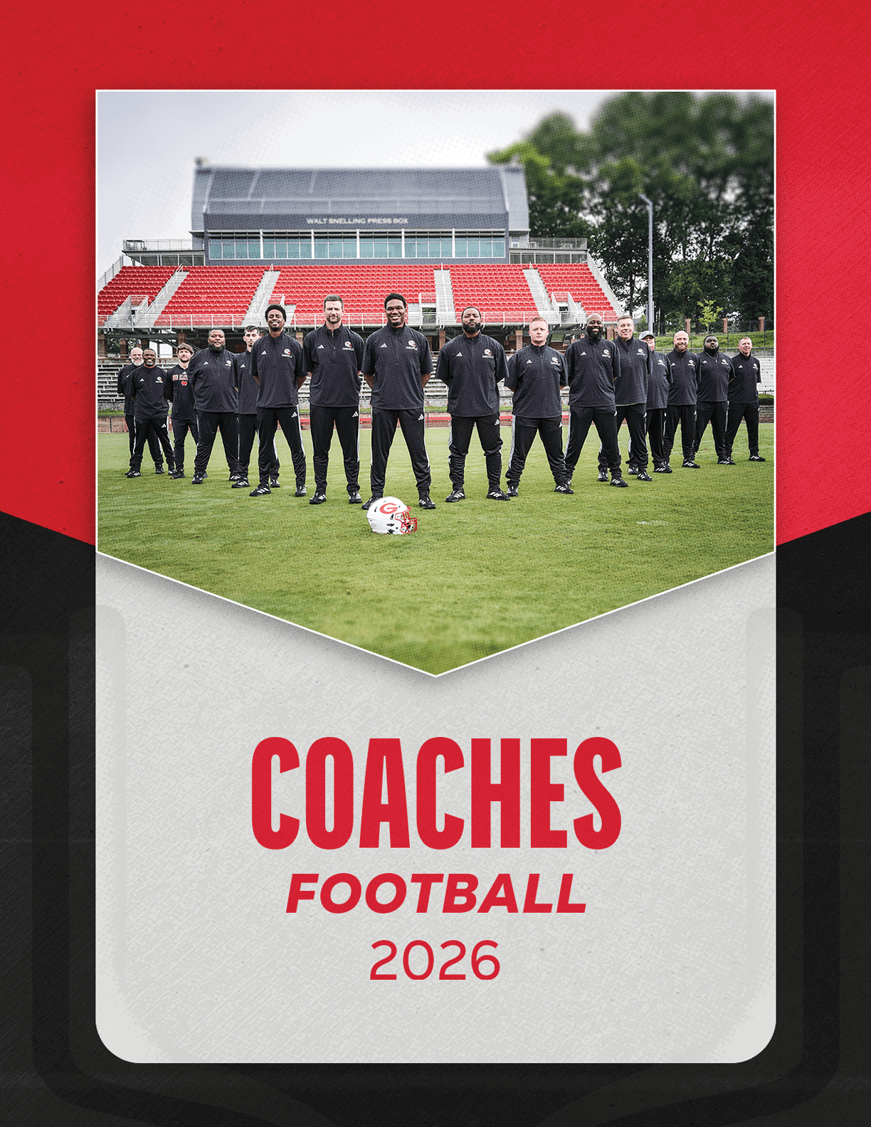 A group of people dressed in black sportswear stands on a soccer field in front of red and white stadium seats with a soccer ball placed on the grass in front of them and the text “COACHES FOOTBALL 2026" below. Description generated by AI