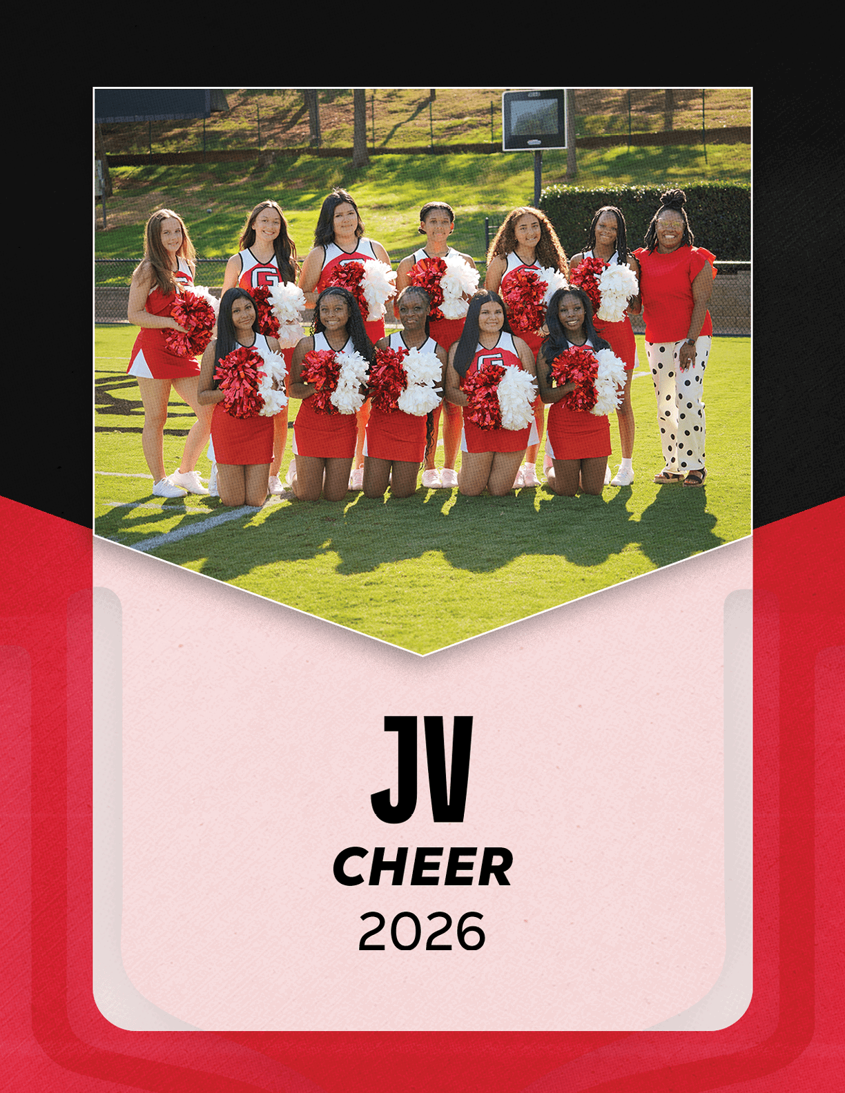 A group of people in red cheerleading uniforms holding red and white pom-poms pose on a grassy field with a basketball hoop in the background and text below reading JV Cheer 2026. Description generated by AI