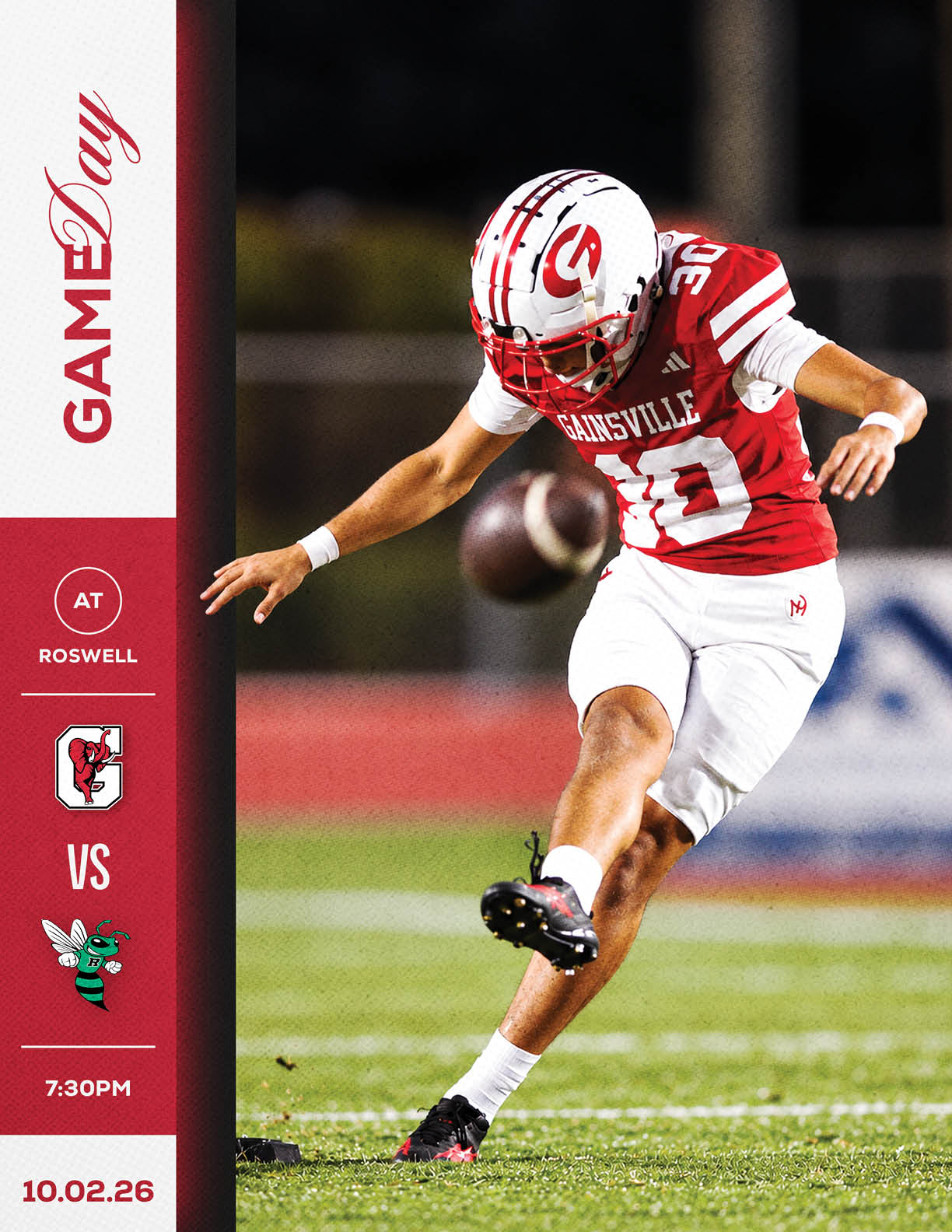 A person in a red and white football uniform is kicking a football on a field during a nighttime game with a graphic showing a matchup between teams at Roswell. Description generated by AI