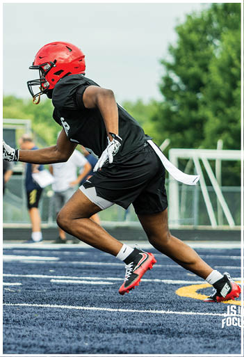 A football player running on the field. Description generated by AI