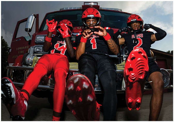 A group of football players wearing black and white uniforms. Description generated by AI