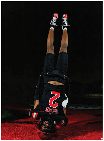 A football player wearing a blue jersey with the number 58 on it. Description generated by AI