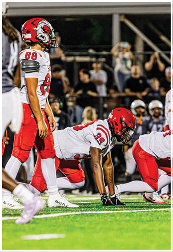 A group of football players celebrating a touchdown. Description generated by AI