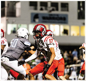 A group of football players celebrating a touchdown. Description generated by AI