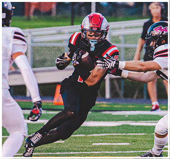 A group of football players celebrating a touchdown. Description generated by AI
