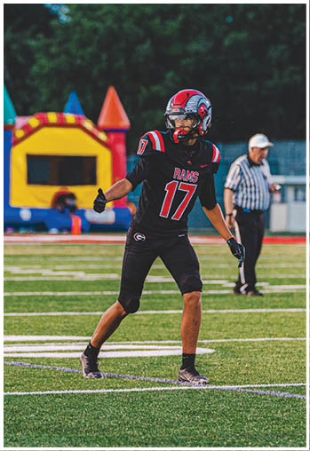 A group of football players celebrating a touchdown. Description generated by AI