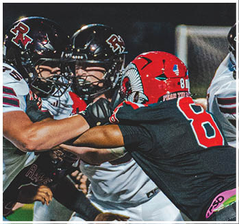 A group of football players celebrating a touchdown. Description generated by AI