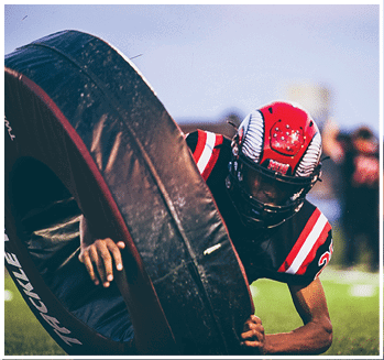 A group of football players celebrating a touchdown. Description generated by AI