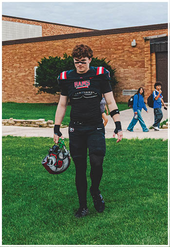 A group of football players celebrating a touchdown. Description generated by AI