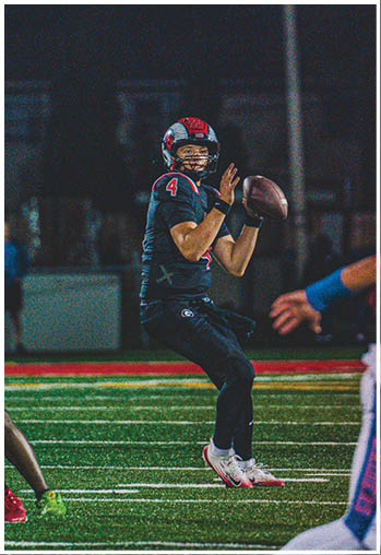 A group of football players celebrating a touchdown. Description generated by AI