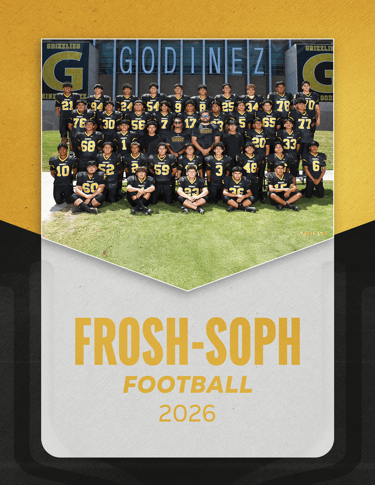 A group of football players sitting on a bench. Description generated by AI