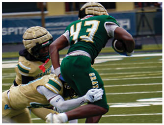 A group of football players on a field. Description generated by AI