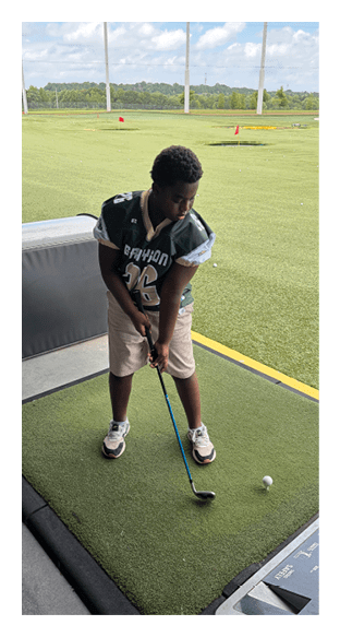 A football player is kneeling on the field, wearing a green jersey and a helmet. AI generated content
