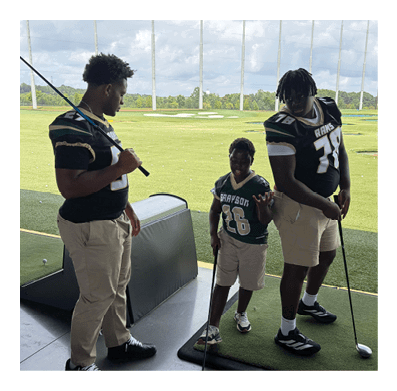 Two men wearing football helmets are talking to each other. AI generated content
