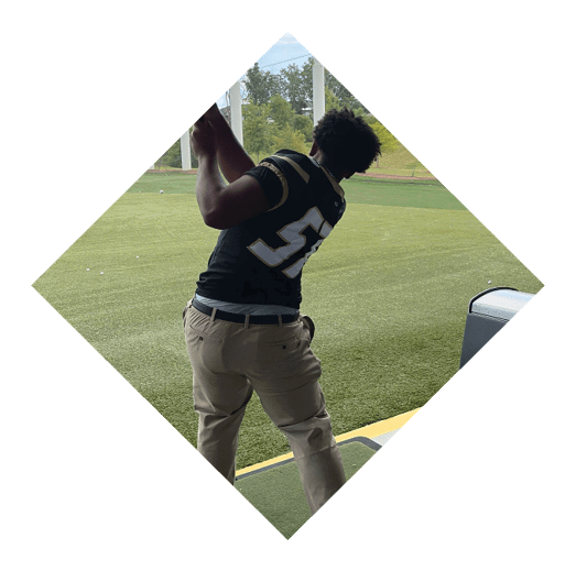 A football player wearing a black jersey with the number 16 on it is holding a football. AI generated content