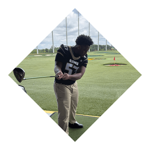 A female football player is kicking a football on a field. AI generated content
