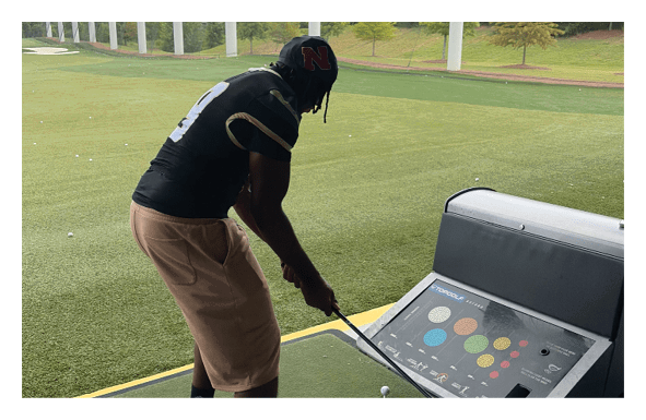 A group of people are kneeling on a field, possibly in a football game. AI generated content