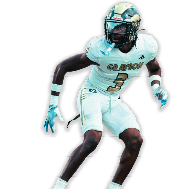 A person wearing a white football uniform with the word Grayson and the number 3 is in a crouched, ready stance. Description generated by AI