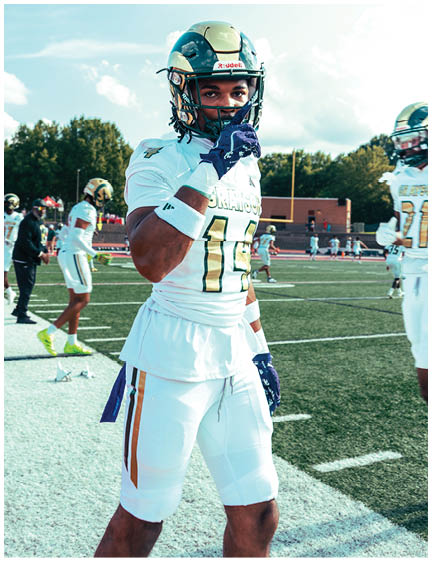 A football player wearing a blue jersey with the number 58 on it. Description generated by AI