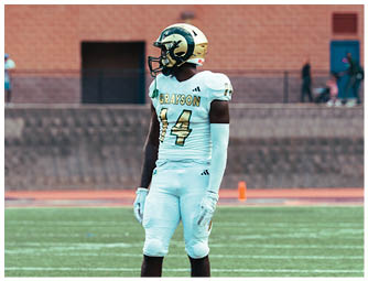 A group of football players on a field. Description generated by AI
