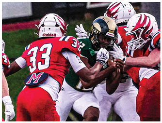 A group of football players on a field. Description generated by AI