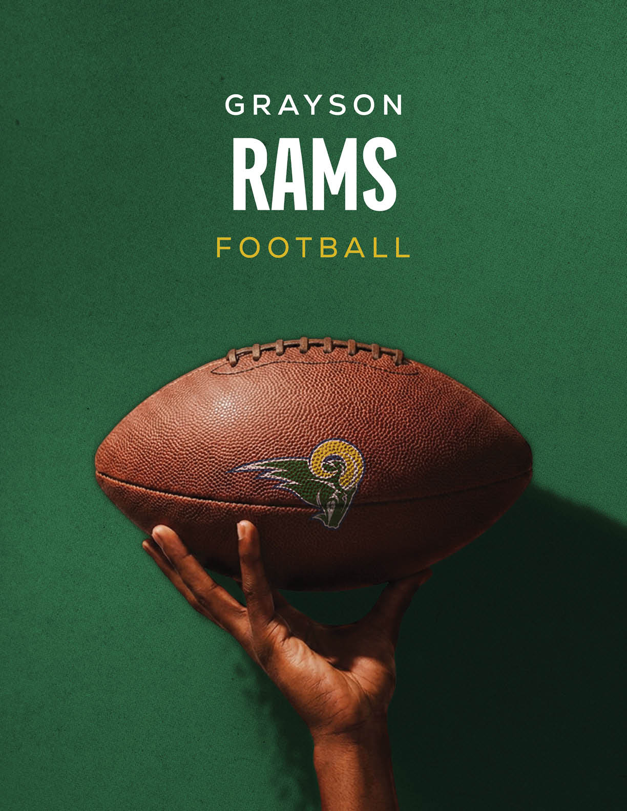 A football is being held by a person. Description generated by AI