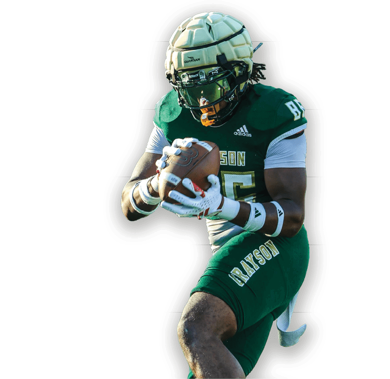 Person wearing a green football uniform and helmet is holding a football while running. Description generated by AI