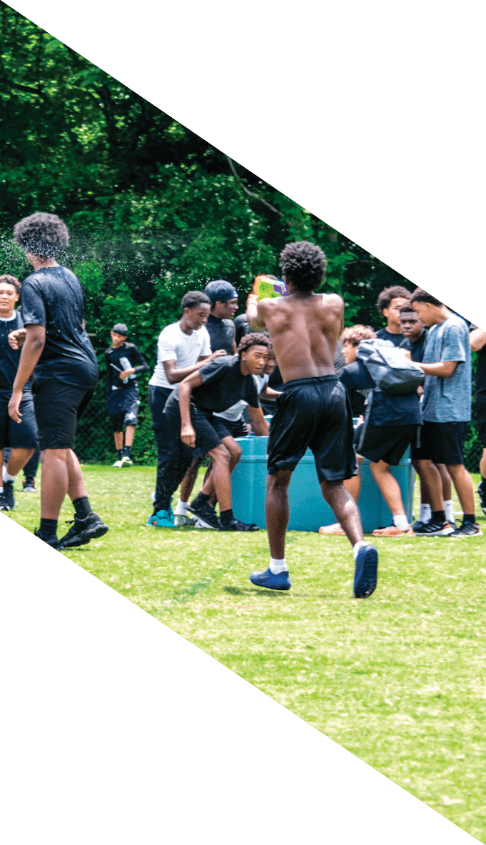 A football team is gathered around a coach, listening to his instructions. AI generated content