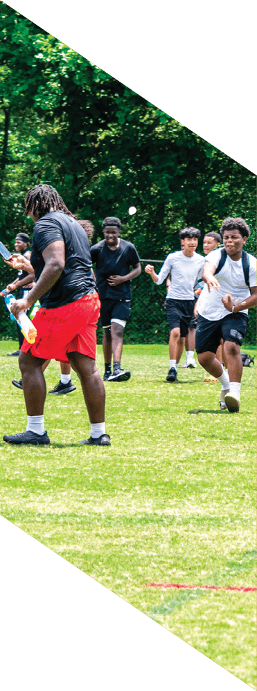 Two young men wearing football uniforms and making hand gestures. AI generated content