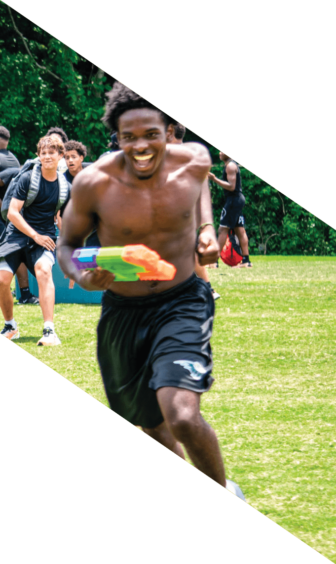 A group of football players pose for a picture. AI generated content