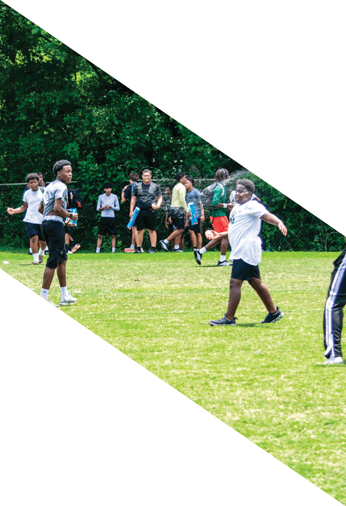 Four football players pose for a picture on the field. AI generated content