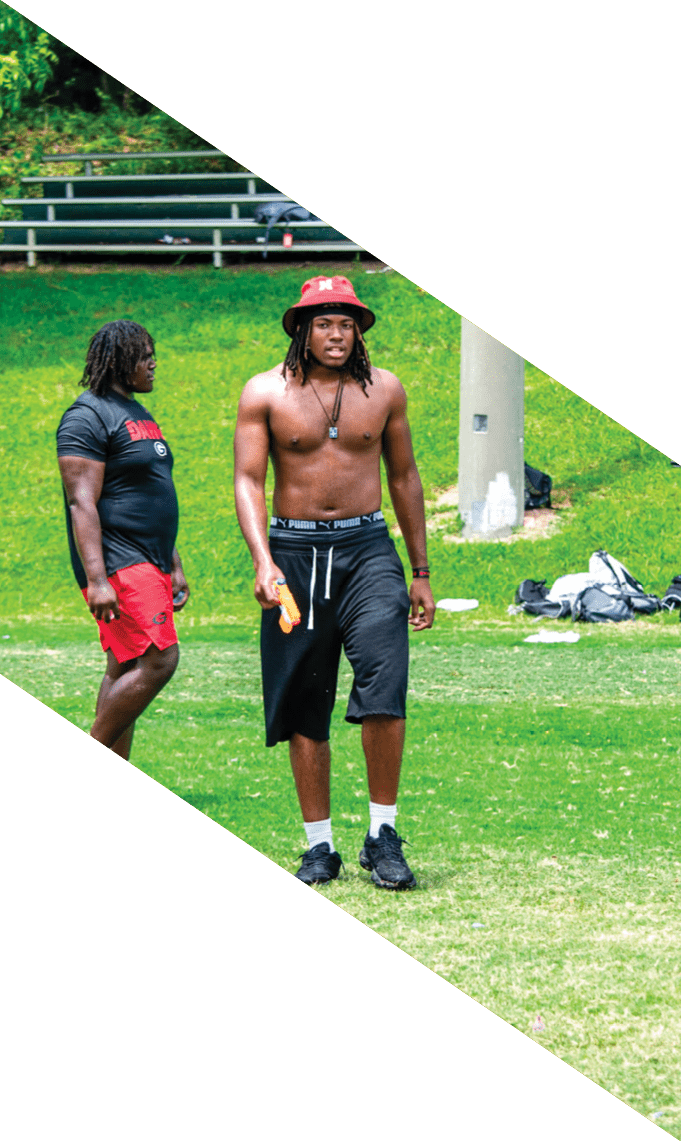 A group of football players pose for a picture. AI generated content
