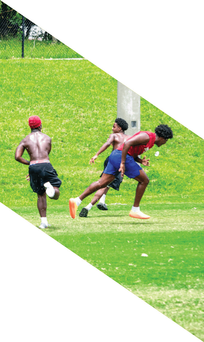 Three men wearing football uniforms are posing for a picture. AI generated content