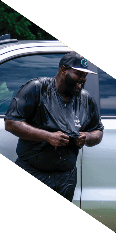 A group of football players wearing headphones and smiling. AI generated content
