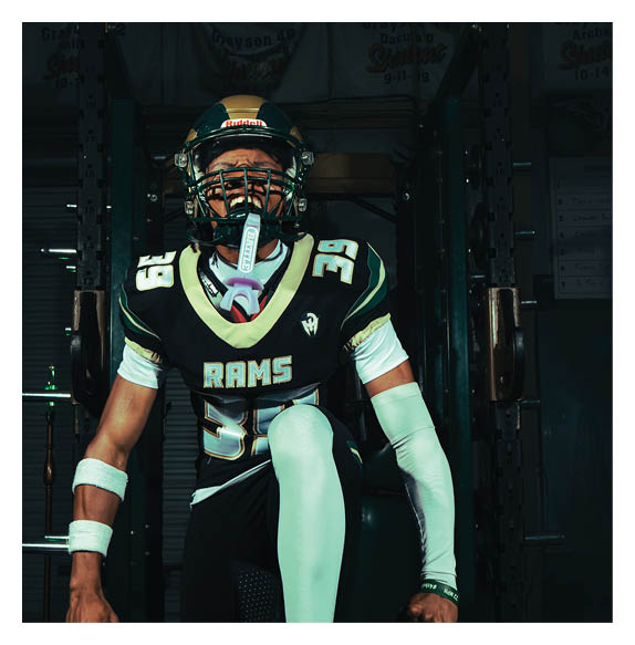 Two football players wearing Vista jerseys and holding hands. AI generated content