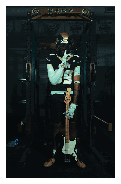 A football player wearing a black and white uniform with the number 10 on the back. AI generated content