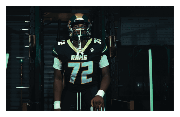 A group of football players wearing headphones and smiling. AI generated content