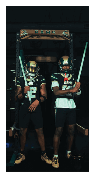 A football player is kneeling on the field, wearing a green jersey and a helmet. AI generated content