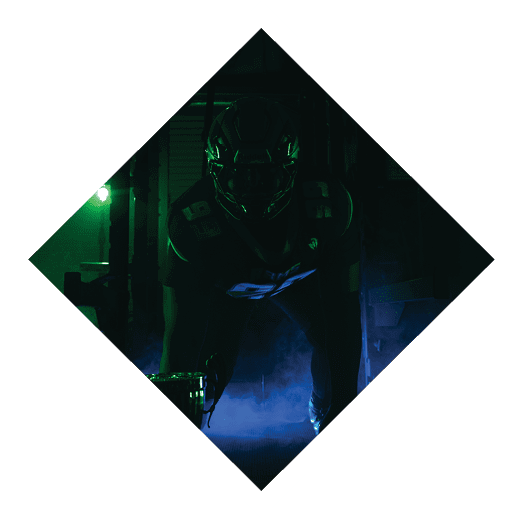A football player wearing a black jersey with the number 16 on it is holding a football. AI generated content