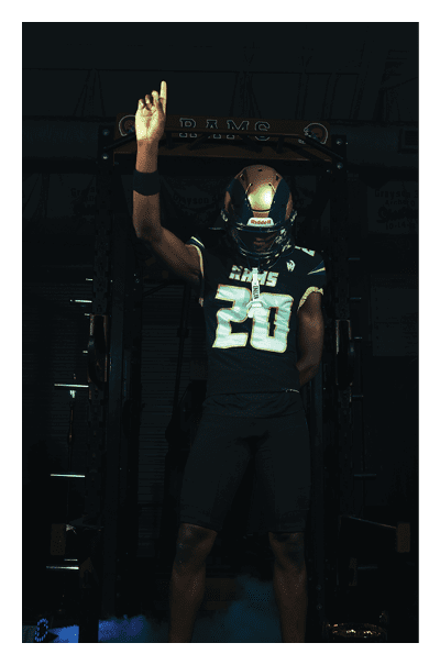 A football player wearing a black and white uniform with the number 10 on the back. AI generated content