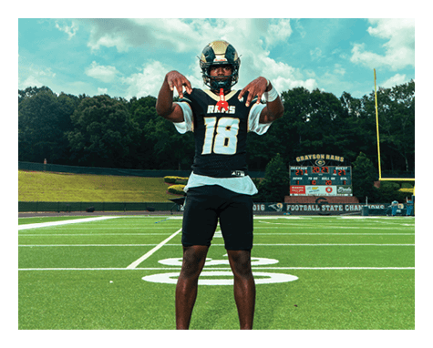 A man wearing a football uniform is jumping to catch a football. AI generated content